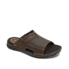 Rockport-Darwyn Sandal The Darwyn sandal from Rockport ensures classic style whether strolling the beach or lounging on the patio. These slides feature a smooth leather construction and are finished with a truTECH cushion at the heel for daylong comfort. Slip-on Open Toe Sandals For Outdoor, Outdoor Slip-on Open Toe Sandals, Outdoor Slip-on Sandals With Open Toe, Outdoor Open Toe Slippers With Cushioned Footbed, Leather Slides With Ortholite Insole For Outdoor, Leather Slip-on Slides For Outdoor, Leather Slide Flip Flops For Outdoor, Beach Slides With Ortholite Insole And Open Toe, Comfortable Open Toe Clogs For Outdoor