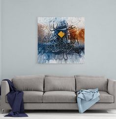 an abstract painting on the wall above a couch