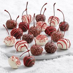 there are many chocolates with red and white sprinkles on them