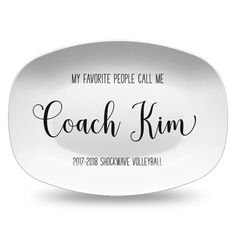 a white plate with the words coach kim on it