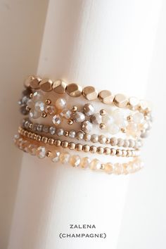 Indulge in the exquisite beauty of the Zalena Beaded Bracelet Sets, a stunning collection of gold and crystal layering bracelets. These bracelets feature intricate crystal beaded floral clusters that radiate elegance and sophistication. The combination of shimmering crystals and delicate gold accents creates a harmonious blend of luxury and femininity. Each bracelet is carefully crafted to showcase the intricate floral designs, making them a true statement piece. Whether worn individually to add Elegant Multi-strand Bracelets With Colorful Beads, Elegant Rondelle Beaded Bracelets With Colorful Beads, Elegant Rondelle Beaded Bracelets, Elegant Gold Crystal Bracelet With Tiny Beads, Elegant Beige Beaded Bracelets, Elegant Multi-strand Faceted Beads Bracelets, Elegant Multi-strand Beaded Bracelets With Faceted Beads, Gold Multi-strand Stackable Beaded Bracelets, Beige Jewelry With Colorful Beads For Jewelry Making