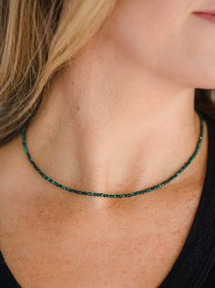 Malachite, with its deep green color, is a powerful protection stone. It is a guardian of the heart and helps remove blocks from the heart chakra. The swirls and circles in the crystal are soothing, inviting and calming to the heart. Our Malachite tiny gemstone necklace allows transformation, attracting the people and experiences you need in order to take that quantum leap. ~ 2.5mm microfaceted Malachite beads~ 14k gold-filled lobster clasp~ 16” length~ Includes a crystal meaning card and reusable cotton bag~ Handmade in beautiful Boulder, Colorado Adjustable Green Emerald Necklace, Green Crystal Necklaces For May Birthstone, Green Spiritual Necklace With Birthstone, Green Necklace For Meditation - May Birthstone, Jade Necklace For May Birthstone With Spiritual Style, Spiritual Jade Necklace For May Birthstone, Green Gemstone Crystal Necklace For Meditation, Spiritual Green Onyx Necklace With Gemstone Beads, Spiritual Green Necklace For May Birthstone