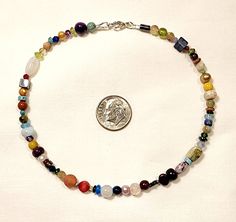 This fantastic Power bracelet or anklet is full of real crystal multicolor gemstones! There are so many varieties and shapes to behold that it's like a shimmering gemstone extravaganza! This bracelet or anklet is made to order, and the gemstones on it and the order in which they are strung will vary. The Gemstones included are my choice, and they may possibly include: Amethyst, Bronzite, Turquoise, Lapis, Freshwater Pearls, Kyanite, Ruby, Apatite, Citrine, Jasper, Agate, Quartz, Peridot, and Gar Multicolor Round Beads Anklets For Gift, Multicolor Round Beads Anklets As Gift, Gift Multicolor Round Beads Anklets, Gift Multicolor Round Bead Anklets, Adjustable Multicolor Multi-stone Crystal Bracelet, Multicolor Multi-stone Adjustable Crystal Bracelet, Peridot And Garnet, Power Bracelet, Crystal Rainbow