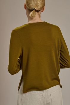 Expertly crafted with 100% merino wool, the Soeur Australie Knit in bronze is both lightweight and warm. Featuring a crewneck and side split hem, this unique sweater is the perfect layer for fall and winter. Experience the luxurious softness and natural warmth of merino wool in a chic green hue. 100% Merino wool Made in China Denim Editorial, Unique Sweater, Unique Sweaters, Brand Campaign, Scarf Dress, Cardigan Shirt, Denim Shoes, Jumper Shirt, Swimwear Outfit