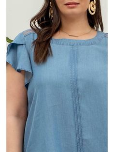 This chambray top with petal sleeves and lace detail is the perfect way to add some fun to a casual look. Pair it with white or colored denim for an elevated weekend vibe to run errands, or dress it up with wedges, dangly earrings, and a fabric or rattan clutch for a casual yet elevated night time look! Either way, this is a classic top that you'll be able to wear to oh-so many things! Brand: Blu PepperDescription: Round Neckline with Short Petal Sleeves Blue Top; Lace Trim Detail; Back Eye Closure Pleating DetailFit Info: Runs true to size, Emily is wearing a size XLBust: The bust is true to sizeWaist: The waist is true to sizeHips: The hips are true to sizeFabric: 100% LyocellSize Reference: XL: 14/16, 2X: 18/20, 3X: 22/24Emily:Size: 14/16Bust 36DHeight 5'4Actual product colors may vary Rattan Clutch, Petal Sleeves, Lace Trim Top, Petal Sleeve, Chambray Top, Night Vibes, Trim Top, Dangly Earrings, Blue Top