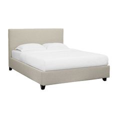 a bed with white sheets and pillows on top of it's headboard, in front of a white background