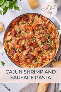 cajun shrimp and sausage pasta in a skillet with parsley on the side