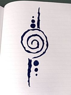 an open notebook with black ink on it and a spiral drawn in the middle is shown