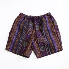 Hey! Just came across these rad Boho Purple Tribal Shorts and had to tell you about them. They've got this awesome deep purple vibe with a tribal twist that's perfect for our summer jam sessions or just lounging at home. The fabric is tough tribal woven stuff, so you know they're going to last through all our adventures. They're rocking an 8" inseam for that just-right length, an elastic waistband, and a drawstring to keep things laid-back and comfortable. Plus, there are pockets on each side. W Purple Cotton Hippie Bottoms, Purple Festival Bottoms With Elastic Waistband, Purple Cotton Bottoms For Festivals, Purple Cotton Festival Bottoms, Festival Purple Bottoms With Elastic Waistband, Purple Relaxed Fit Beach Bottoms, Purple Relaxed Fit Bottoms For Beach, Hippie Bottoms With Built-in Shorts For Festivals, Casual Purple Bottoms For Festival