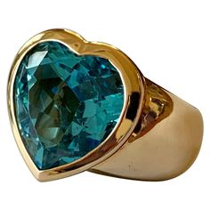 One of a kind solid 18 K rose Gold Ring set with a heart shaped blue Topaz. This unique piece has been designed and handcrafted from the very well known swiss company "Sueños". The owners, Mr and Mrs Rueegg are are highly appreciated by jewellery lovers only looking for the best. Sueños stands for the spanish word dreams and this is exactly what they want to deliver. Contemporary and wearable jewellery creations and designs, custom made for the sophisticated and discerning clientele. All is excl Ring With Heart, Unique Ring Designs, Rose Gold Ring Set, K Rose, Genie Bottle, Modern Heart, Heart Shaped Jewelry, Gold Ring Sets, Pretty Rings