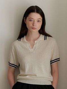 Casual knit sweater that made of lightweight fabric for summer. Featuring the natural V-neckline with open-collar, striped trim at collar and sleeve hems, and loose silhouette. Style with trousers, denim jeans, or skirts to create daily looks. - Open-collar and V-neckline design- Striped trim at collar and sleeve hems- Ribbed trim at collar, sleeve hems, and hem- Relaxed silhouette and standard length- Lightweight and cool fabric for hot summer Casual V-neck Top With Striped Collar, Summer Striped Collar V-neck Top, Summer V-neck Tops With Striped Collar, Summer V-neck Top With Striped Collar, Summer V-neck Top With Contrast Stripes, Casual Collared Tops With Striped Cuffs, Summer Collared Tops With Striped Cuffs, Summer Workwear Tops With Striped Cuffs, Summer Tops With Striped Cuffs For Workwear