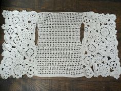 two crocheted doily on a wooden table