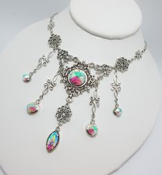 "This is a new handmade necklace. It is made with antiqued silver plated filigrees, accented with high quality CRYSTAL CLEAR AB glass jewels/rhinestones that sparkle like crystals. Decorated portion is 6 1/2\" wide and 3 1/4\" tall in the center. Necklace is adjustable 15-18\" with a lobster clasp and chain extender. If you would like a different length, please send us a message. Matching earrings and headpiece are listed in our store." Gothic Metal Jewelry For Fantasy Events, Silver Jewelry With Jewels For Festivals, Silver Gothic Necklaces For Fantasy Events, Silver Gothic Jewelry For Fantasy Events, Festival Silver Necklace With Jewels, Gothic Silver Necklaces For Festival, Handmade Gothic Silver Jewelry, Handmade Silver Gothic Jewelry, Silver Gothic Dangle Jewelry