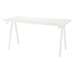 a white table sitting on top of a white floor