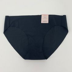 With A Bikini Cut And Low-Rise Fit, This Seamless Underwear Provides Ample Coverage And Security, While Still Remaining Smooth Beneath Your Clothes With The Help Of An Invisible-Edge Design. 100% Cotton Lining Further Contributes To Your Comfort, Helping You Conquer The Day With Confidence And A Sleek, Seamless Look. Material: 77% Nylon, 23% Spandex Lining Fabric: Jersey Material Lining: 100% Cotton Rise: Low Rise Garment Details: Invisible Edge Care And Cleaning: Machine Wash & Tumble Dry Size: Elegant Black Seamless Swimwear, Black Seamless Shapewear Swimwear, Elegant Shaping Black Swimwear, Elegant Black Shaping Swimwear, Black Stretch Swimwear With Smoothing Details, Black Fitted Seamless Bottoms, Fitted Black Bottoms With Seamless Design, High Stretch Black Swimwear With Full Coverage, Black Full Coverage High-stretch Swimwear