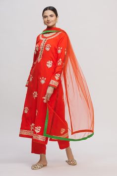 Red tinted orange straight long kurta with all-over floral motif gold tone gota work. Comes with pants and dupatta.
Components:3
Embroidered
Neckline:Round
Sleeve Length:Full
Fabric:
Color:Red
Green loop button placket
Side slits
Cuff sleeves
 - Aza Fashions Red Dola Silk Unstitched Suit For Navratri, Bollywood Style Embroidered Palazzo Set For Puja, Red Chanderi Unstitched Suit With Dabka Work, Red Chanderi Unstitched Suit With Resham Embroidery, Traditional Red Unstitched Suit With Gota Work, Embroidered Palazzo Set For Puja Festival, Festive Embroidered Anarkali Set For Puja, Red Chanderi Traditional Wear With Gota Work, Red Chanderi Palazzo Set With Zari Work