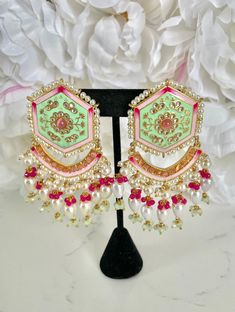 "Mint Green Meenakari Earrings and Tikka Set If you're looking for a jewelry set to wear to an upcoming Indian event, look no further - with handpainted details and pearl accents, this traditional mint green meenakari earring and tikka set has our heart!  These earrings are perfect for Indian weddings and festivities (I would wear these to a sangeet party). These also make for a pretty & memorable gift for special occasions! Details: 1 pair of hand-painted meenakari earrings 1 matching tikka  Shop more of our Indian Earrings here: https://www.etsy.com/shop/jazzyandco?section_id=23690892 What is Meenakari? Meenakari is a Persian art of colouring the surface of metals by fusing brilliant colours. The art was brought to India by Persian enamellists around the early 17th century. Mina is the f Luxury Meenakari Party Sets, Cheap Meenakari Jewelry For Festive Occasions, Affordable Meenakari Jewelry For Festive Season, Cheap Traditional Meenakari Earrings, Luxury Designer Meenakari Jewelry, Festive Meenakari Jewelry, Green Meenakari Dangle Danglers, Green Meenakari Chandelier Earrings For Diwali, Fusion Style Jhumkas With Gota Work For Festivals