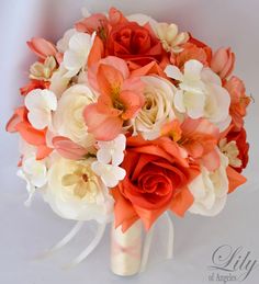 a bridal bouquet with orange and white flowers