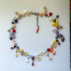 15" length, adjustable with 1.5" extension chain fully stainless steel and made with glass, stone, and shell beads Multicolor Glass Beaded Necklaces With Adjustable Chain, Artisan Multicolor Glass Necklaces, Multicolor Glass Necklace With Chain, Multicolor Multi-strand Glass Necklaces, Artisan Multicolor Glass Necklace, Abstract Art Wallpaper, Shell Beads, Art Wallpaper, Favorite Jewelry