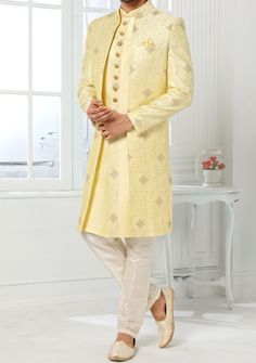 Readymade Art Silk Sherwani, and Jacket. Art Dupion Aligarhi Ready Made Trouser. Resham, Sequences, and Zari Work. Crafted in Chinese Collar Neck, and Full Sleeve. Faux Satin Lining with Plain Work. High-Quality Matching Buttons. Please Note: The footwear shown in the picture is for presentation and photography purpose only. Color: There might be slight color variation due to lightings and flashes while photo shooting. The color may also vary because of different screen resolutions. Wash Care: D Traditional Suits With Dabka Work For Festive Occasions, Traditional Festive Suits With Dupatta, Bollywood Style Festive Suits, Festive Suits With Resham Embroidery For Festivals, Traditional Designer Suits With Dupatta, Straight Kurta Outerwear For Eid, Straight Kurta For Eid Festivities, Bollywood Style Outerwear With Zari Work For Festive Season, Festive Outerwear With Dupatta For Eid