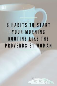 a blue coffee cup sitting on top of a table next to a white book with the words 6 habitts to start your morning routine like the provers 31 woman