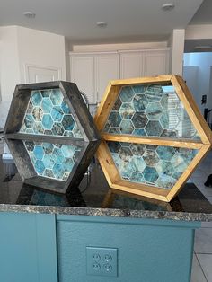 two glass trays sitting on top of a kitchen counter