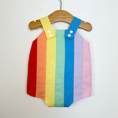 Baby retro rainbow romper. Poppers for easy changing, relaxed fit, plenty of room for nappies (cloth or disposable). Fully lined with light soft cotton. Seamless insides making them comfortable against babies skin. Rainbow design made up of carefully selected colours of 100% premium quality cotton. Adjustable length straps. Multicolor Jumpsuits And Rompers For Spring Playtime, Multicolor Cotton Onesie For Summer, Cute Multicolor Cotton Bubble Romper, Cute Multicolor Jumpsuits And Rompers For Playtime, Multicolor Jumpsuits And Rompers For Summer Playwear, Summer Multicolor Cotton Onesie, Summer Multicolor Cotton Jumpsuits And Rompers, Summer Multicolor Sleeveless Bubble Romper, Summer Sleeveless Multicolor Bubble Romper