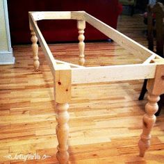 a wooden table sitting on top of a hard wood floor