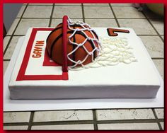 a cake made to look like a basketball and net on top of a tile floor