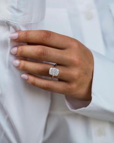 a close up of a person wearing a ring