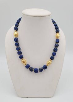 It's Beautiful Natural Lapis Lazuli Stone Beads Necklace With Gold Plated Beads In Between its Totally Handmade Necklace Its Wonderful Necklace Beautiful Color Lapis Lazuli Stone From AfghanistanMaterial Gold PlatedGemstone Lapis LazuliLength 54cm Festive Beaded Necklace With Oval Beads, Lapis Lazuli Beaded Necklaces With Large Beads As Gift, Lapis Lazuli Beaded Necklace With Large Beads For Gift, Lapis Lazuli Gemstone Beads For Jewelry Making, Gold Lapis Lazuli Faceted Beads Necklace, Gold Lapis Lazuli Necklace With Faceted Beads, Gold Oval Beads For Jewelry Making, Festive Beaded Necklaces With Gemstone Beads, Festive Gemstone Beads Necklace