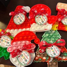 christmas themed candy trays are arranged on a table