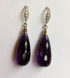 "Luxury Purple Amethyst sterling Silver Pave Earrings. Statement jewelry. Ultra violet stone dangles. February birthday. Artisan, Purple Amethyst Stone silver pave earrings. Vintage inspired, Pave sterling silver French earwires studded with tiny CZ in front that look like Diamonds. Elegant, sophisticated, and classy! These two lavish, faceted, AAAA+ quality, dark purple Amethyst briolettes are gems with vibrant purple hues, both stones are approximately 31 carats, each 22 x 10mm, the earrings a Purple Fine Jewelry Earrings For Formal Occasions, Elegant Purple Pierced Earrings, Formal Amethyst Gemstone Earrings, Amethyst Gemstone Earrings For Formal Occasions, Amethyst Briolette Earrings For Formal Occasions, Elegant Amethyst Dangle Earrings, Formal Amethyst Briolette Earrings, Elegant Lavender Earrings With Gemstone Accents, Lavender Fine Jewelry Earrings For Formal Occasions