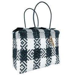 a black and white checkered handbag on a white background