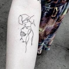 a person with a tattoo on their arm