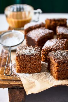 several pieces of brownies on a wooden cutting board