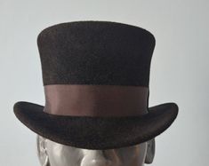 Classic Black Top Hat by waverleyg | Etsy Classic Brown Top Hat For Formal Occasions, Classic Brown Formal Top Hat, Fitted Brown Brimmed Top Hat, High Crown Fitted Hat For Costume, Fitted High Crown Hat For Costumes, Fitted Top Hat With Curved Brim For Costume, Formal Cloche Mini Hats For Winter, Formal Winter Cloche Mini Hat, Formal Brown Brimmed Top Hat