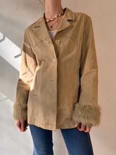 "- Vintage Suzy Shier beige jacket with faux fur cuffs - Suede leather shell with lining - A couple very small marks throughout - Tagged M  Chest: 18\" Length: 27.5\" Sleeve: 23\" Shoulder: 16.5\"" Beige Fur Coat With Faux Fur Trim For Spring, Trendy Beige Leather Jacket For Winter, Vintage Fur Coat With Faux Fur Lining For Spring, Fitted Vintage Beige Leather Jacket, Beige Single-breasted Leather Jacket For Winter, Vintage Spring Outerwear With Faux Fur Trim, Faux Fur Jacket Outfit, Winter Suede Button-up Outerwear, Vest Outfits Aesthetic