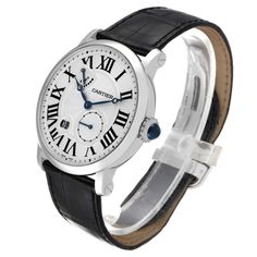 Cartier Rotonde 18k White Gold Silver Dial Mens Watch W1556202. Manual winding movement. 18k white gold case 42.0 mm in diameter. Circular grained crown set with the blue spinel cabochon. Exhibition sapphire crystal case back. . Scratch resistant sapphire crystal. Silver guilloche dial with black roman numerals. Blued steel hands. Secret Cartier signature at VII. Large date window located between 7 and 8 o'clock position.  Small seconds sub-dial above the 5 o'clock position. Power reserve indica Rolex Date, Blue Spinel, Silver Water, 5 O Clock, Gold Watch Men, Blue Steel, Gold Case, Skeleton Watch, Swiss Watches