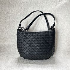 Super Cute Dot Crossbody Bag From Bottega Veneta Featuring Brand Signature Intriciato Pattern Luxe Calf Leather With Intriciato Pattern Classic Black Color Vintage Black Hardwares Bottom Side Gathering Details Top Zip Closure Inside Fabric Lining Fully Lined Single Leather Strap, Detachable Measurements Approximately 8.5in L X 7in H X 4in D Classic Shoulder Bag With Intrecciato Weave, Classic Woven Leather Office Bag, Classic Intrecciato Weave Shoulder Bag, Classic Woven Leather Shoulder Bag For Office, Classic Intrecciato Weave Shoulder Bag For Daily Use, Classic Crossbody Bag With Intrecciato Weave, Black Woven Leather Crossbody Bucket Bag, Elegant Shoulder Bag With Intrecciato Weave For Daily Use, Black Woven Leather Shoulder Bag For Everyday