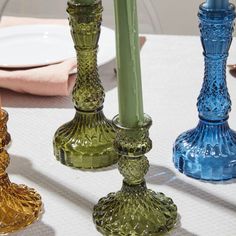 Add a vintage sensibility with on-trend color to your table centerpieces with the tall Gillian Candlestick, designed classic with a twist. This blue glass candle holder offers visual impact & easy elegance to wedding & event design. It holds a standard taper candle & fits under a 4-inch glass sleeve. Pair with our colorful glassware, including the Momento & Pomona Drinkware collections, for a stunning, coordinated tablescape. Small: 3in Dia x 4in H, Large: 3.25in Dia x 6.75in H Finish: Yellow, P Green Glass Candle, Spring Wine, Wedding Event Design, Glass Candle Holder, Candle Tray, Taper Candle Holders, Antique Inspiration, Wall Sculpture Art, Glass Candle Holders