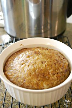 a casserole dish sitting on top of a rack next to an instant pressure cooker