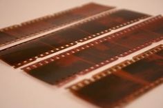 three brown film strips sitting on top of each other