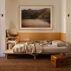 a bedroom with a tennis court on the wall next to a bed and nightstands