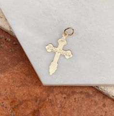 10K yellow gold detailed Eastern Orthodox cross pendant charm. Length: 25mm not including bail Width: 17mm Weight: .78 gram Made in USA Stamped 10K Chain shown is sold separately 14k Gold Crucifix Spiritual Jewelry, Yellow Gold Cross Pendant Stamped 14k, 14k Gold Spiritual Crucifix Jewelry, 14k Gold Cross Pendant Spiritual Jewelry, Nickel-free Gold Cross Necklace, Yellow Gold 14k Stamped Cross Pendant, Yellow Gold Crucifix With Miraculous Medal, Nickel-free Gold Crucifix Jewelry, Spiritual 14k Gold Cross Pendant