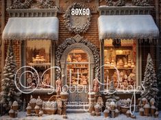 an image of a store front with snow on the windows and decorations around it for christmas