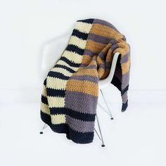 a chair with a blanket on top of it