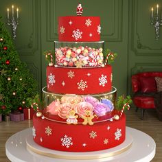 a three tiered christmas cake with candy and candies in it on a table