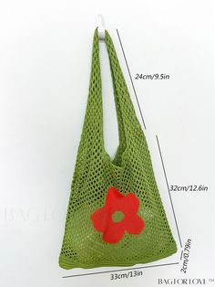 a crocheted bag with a red flower on the side and measurements for it