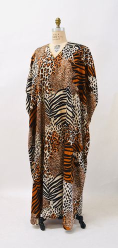 "Amazing Dress features * Constructed soft poly woven fabric with textured jacquard * Animal Print in beautiful amber brown and neutral cream * Gold metallic piping along neckline * Extended shoulders with removable shoulders * Open relaxed body with stitching along sides to create a caftan look * Slip On style * Super cool By Bella Maya No Size, fits like a Large XL Great vintage condition Bust 75\" Hips 70\" Length from top of shoulder 59\" All Measurements given in full, xo hooked on honey, B Vintage Leopard, Amber Brown, Silk Kaftan, Animal Print Dress, Wedding Gowns Vintage, Plus Size Vintage, 80s Dress, Beaded Gown, Pageant Dress